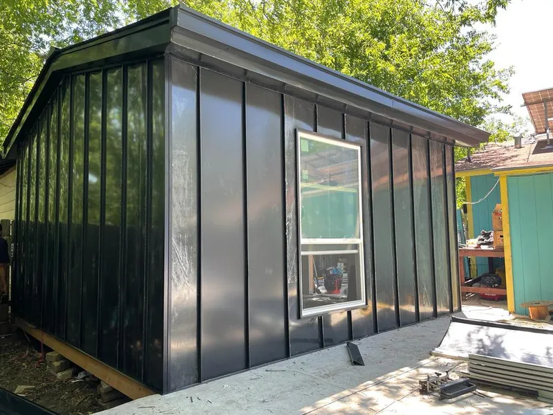 Black standing seam metal wall panels for Roof Inspection in Eldridge